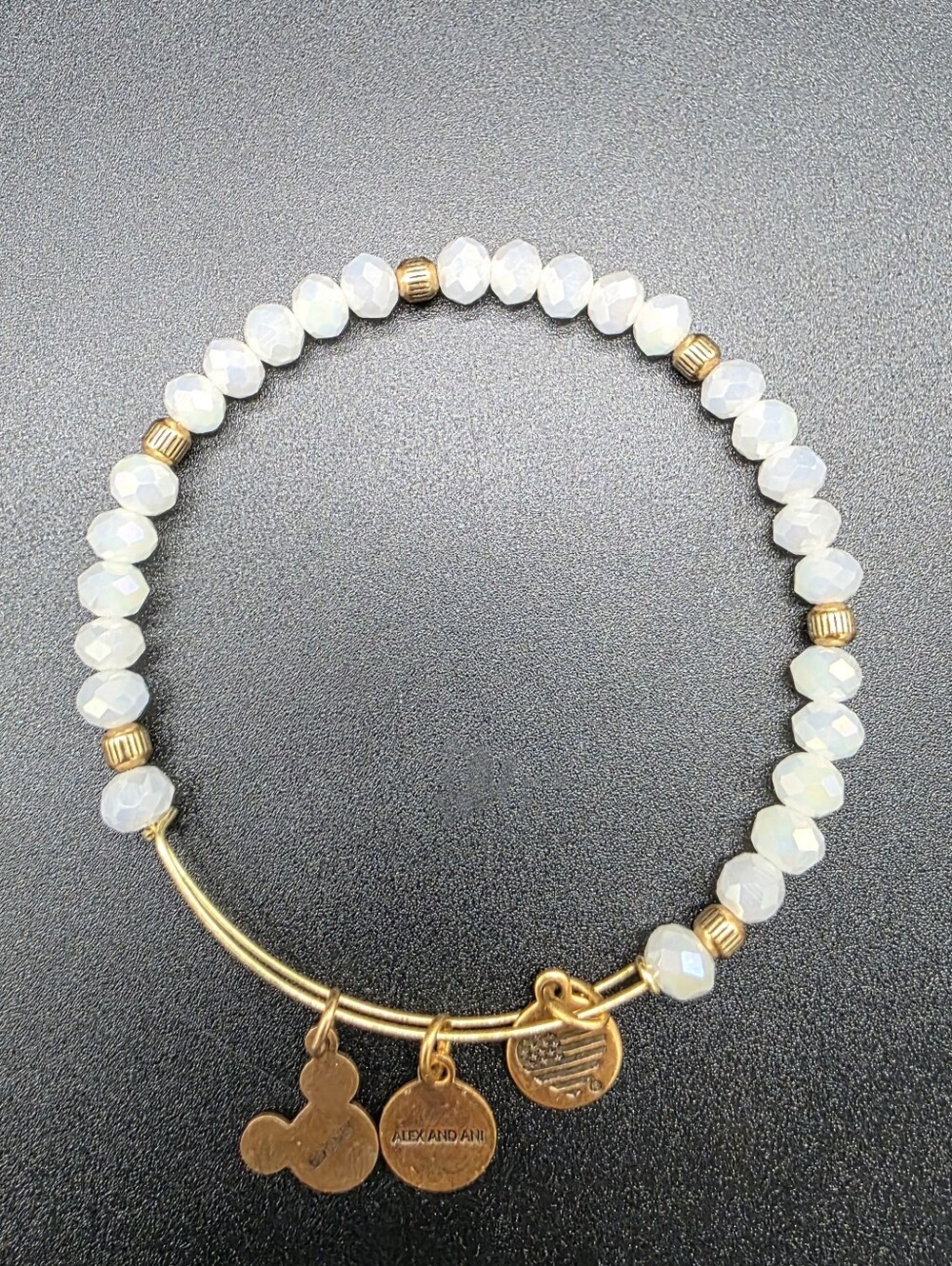 Alex and Ani Disney Parks gold-tone bangle features a Mickey Mouse Heart Flag